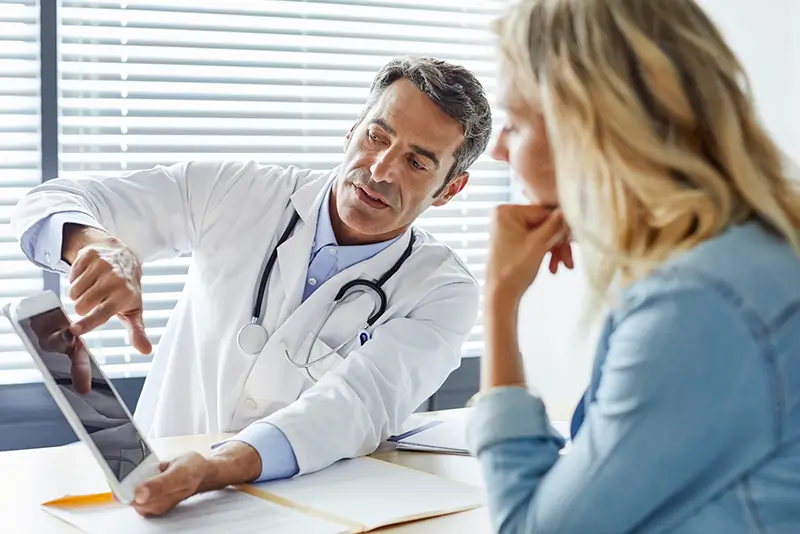 doctor going over test results with patient