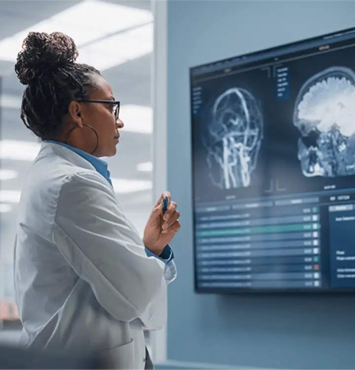 Researcher looking at brain scans